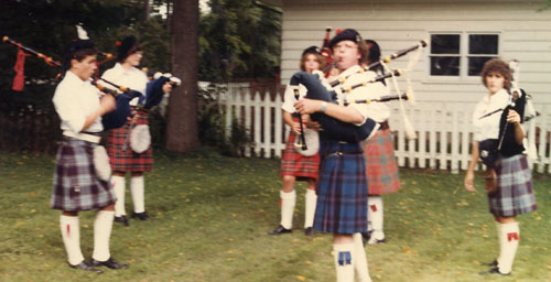 Jim with students in backyard band